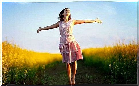 Happy woman in a field 