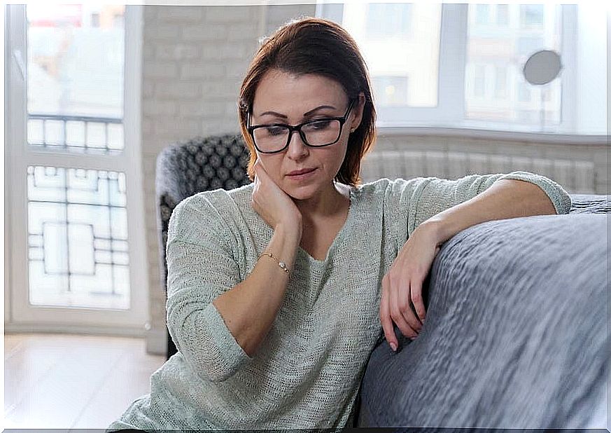 A woman thinking about the keys to happiness