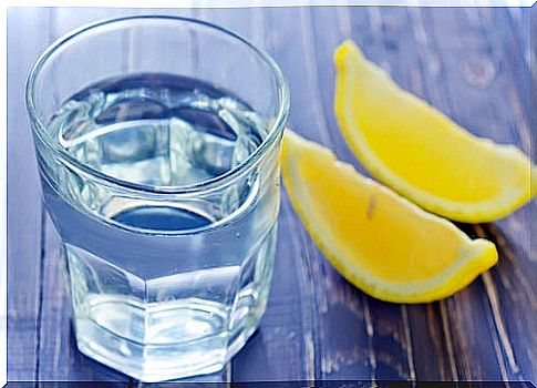 Glass of water and lemon on a table