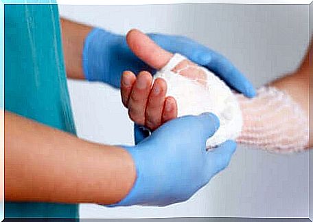 A surgeon examining a hand operated on for brachydactyly.